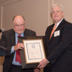 Dr. Bower receiving award